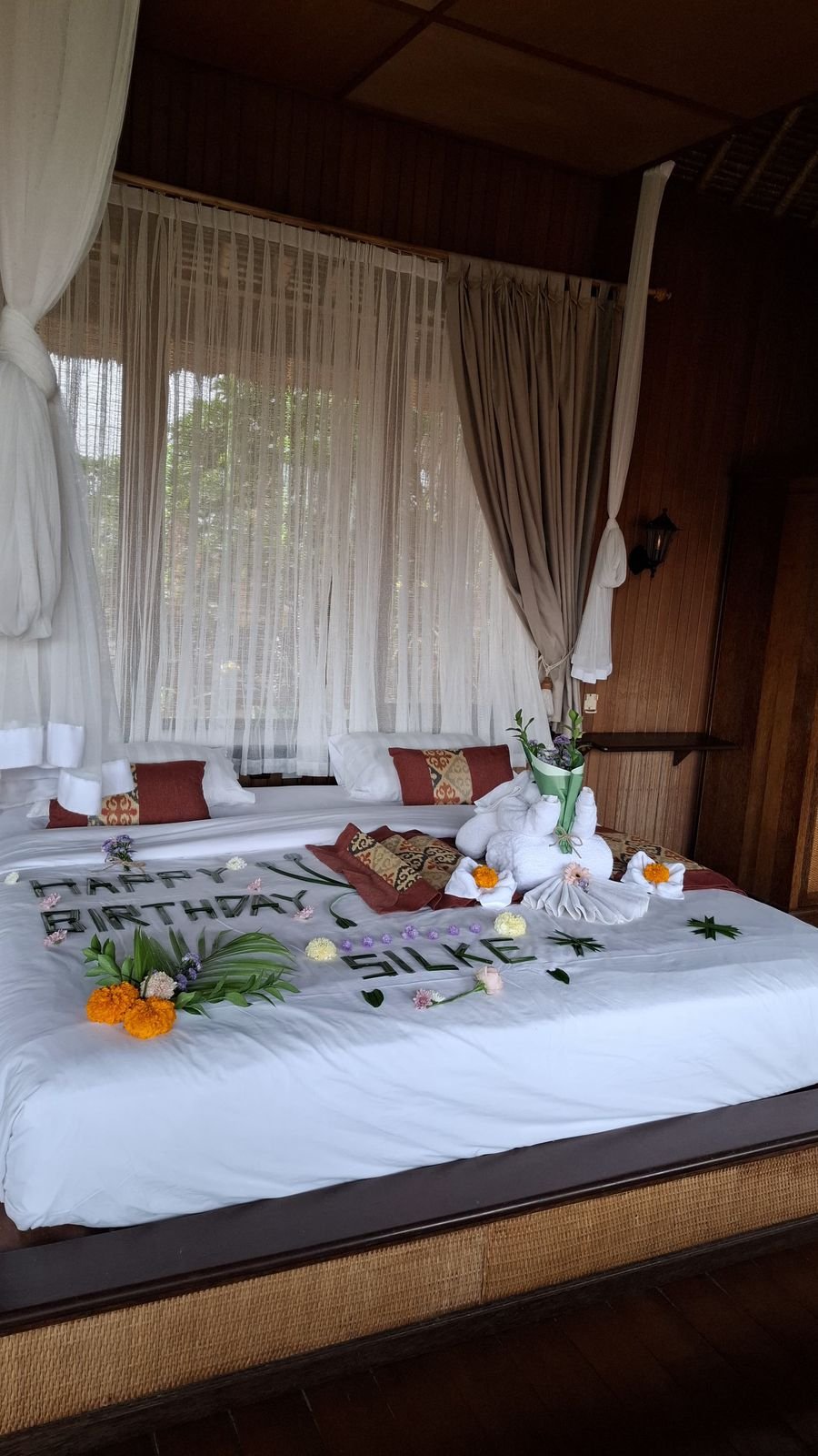 Decorated bed for birthday celebration called Blooming Birthday Suite