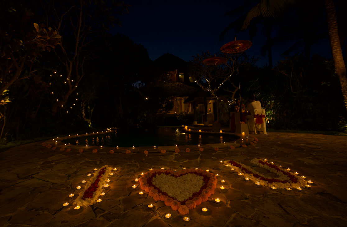 Romantic candlelit garden setting.