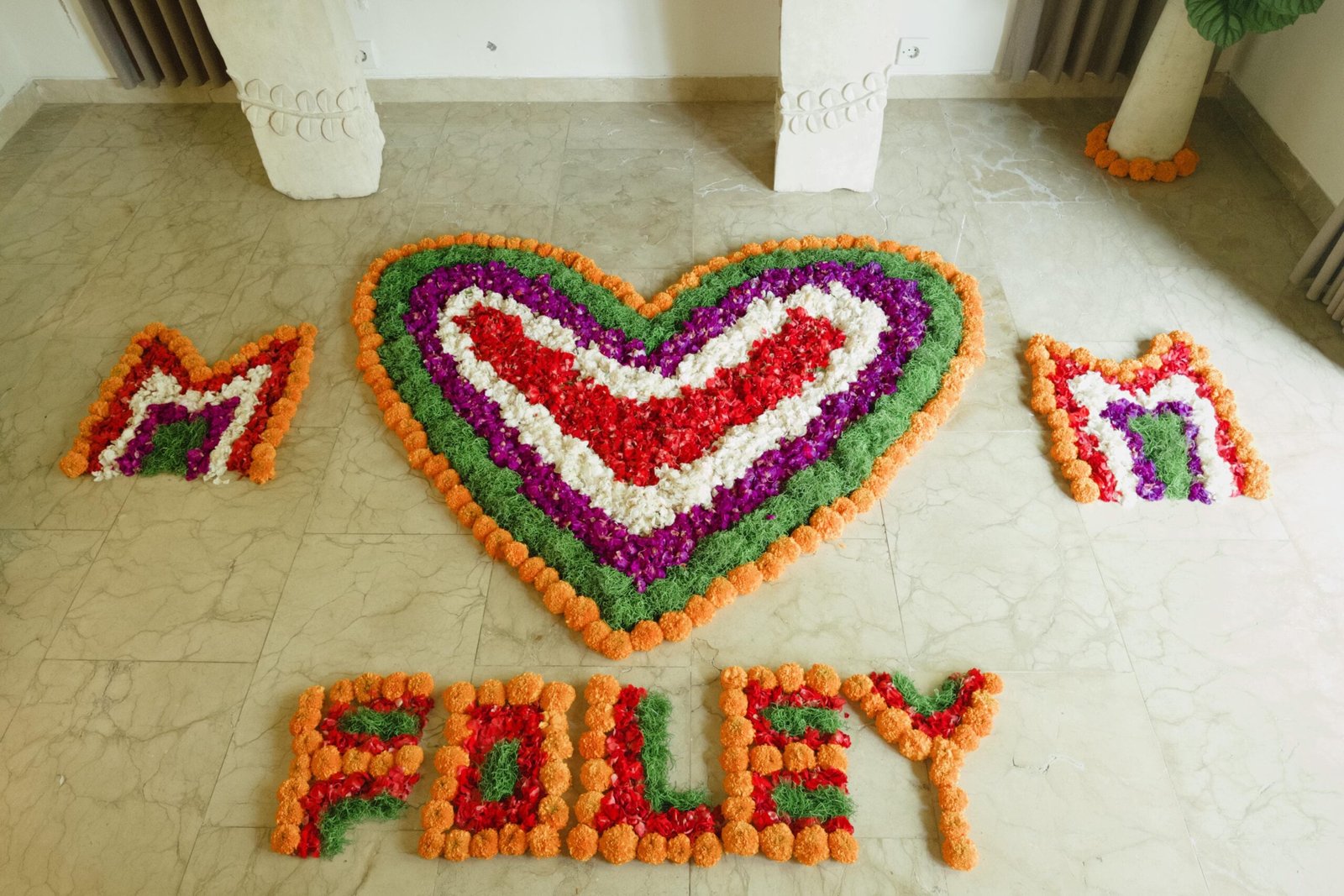 Colorful flower arrangement spelling 'FOLEY'