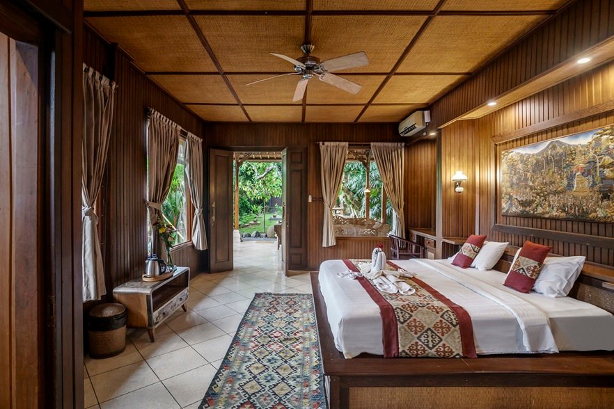 Cozy wooden bedroom with nature view