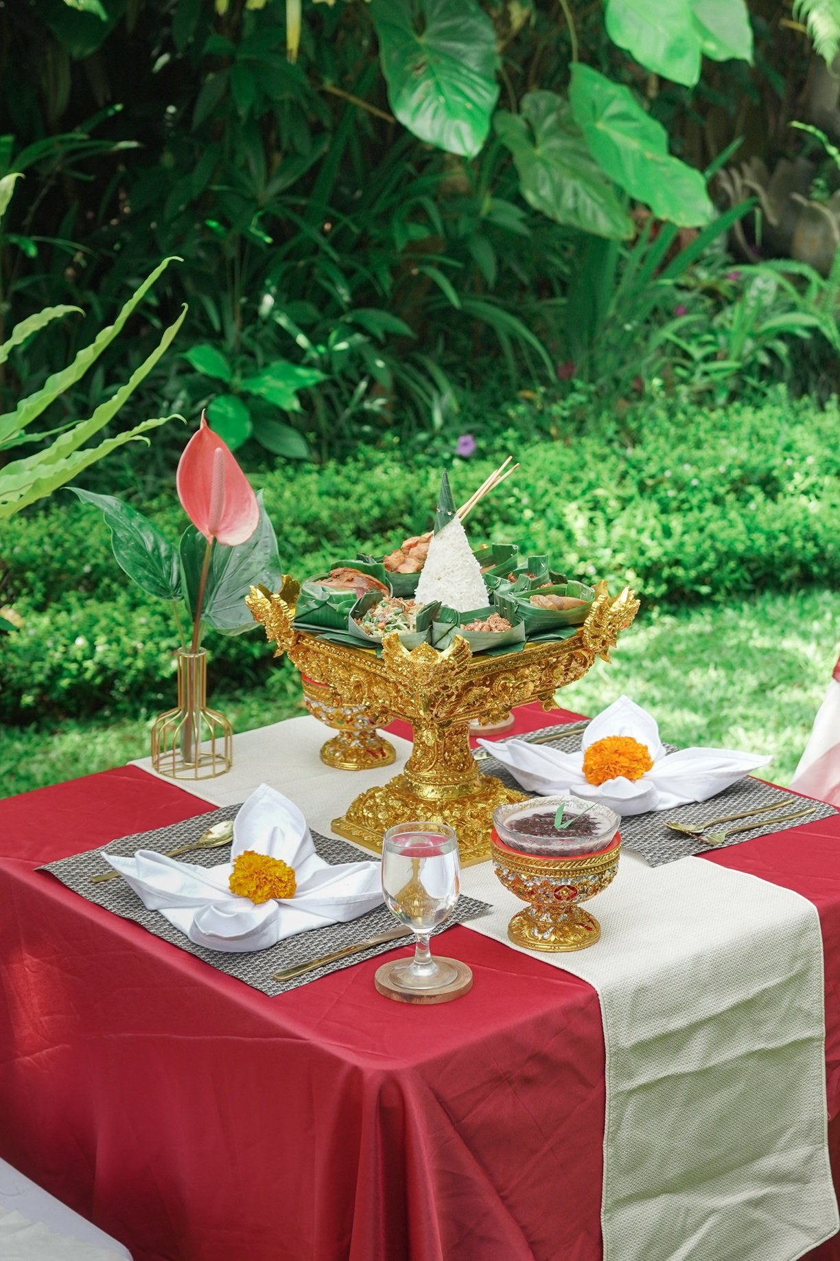 Elegant outdoor dining setup with decorations for romantic dinner called serenade by the stars